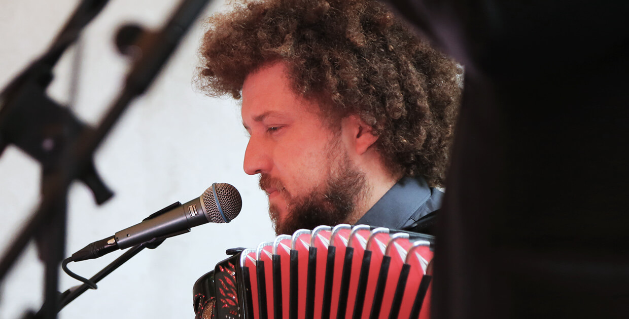 Janez Dovč playing accordion at Hostel Celica